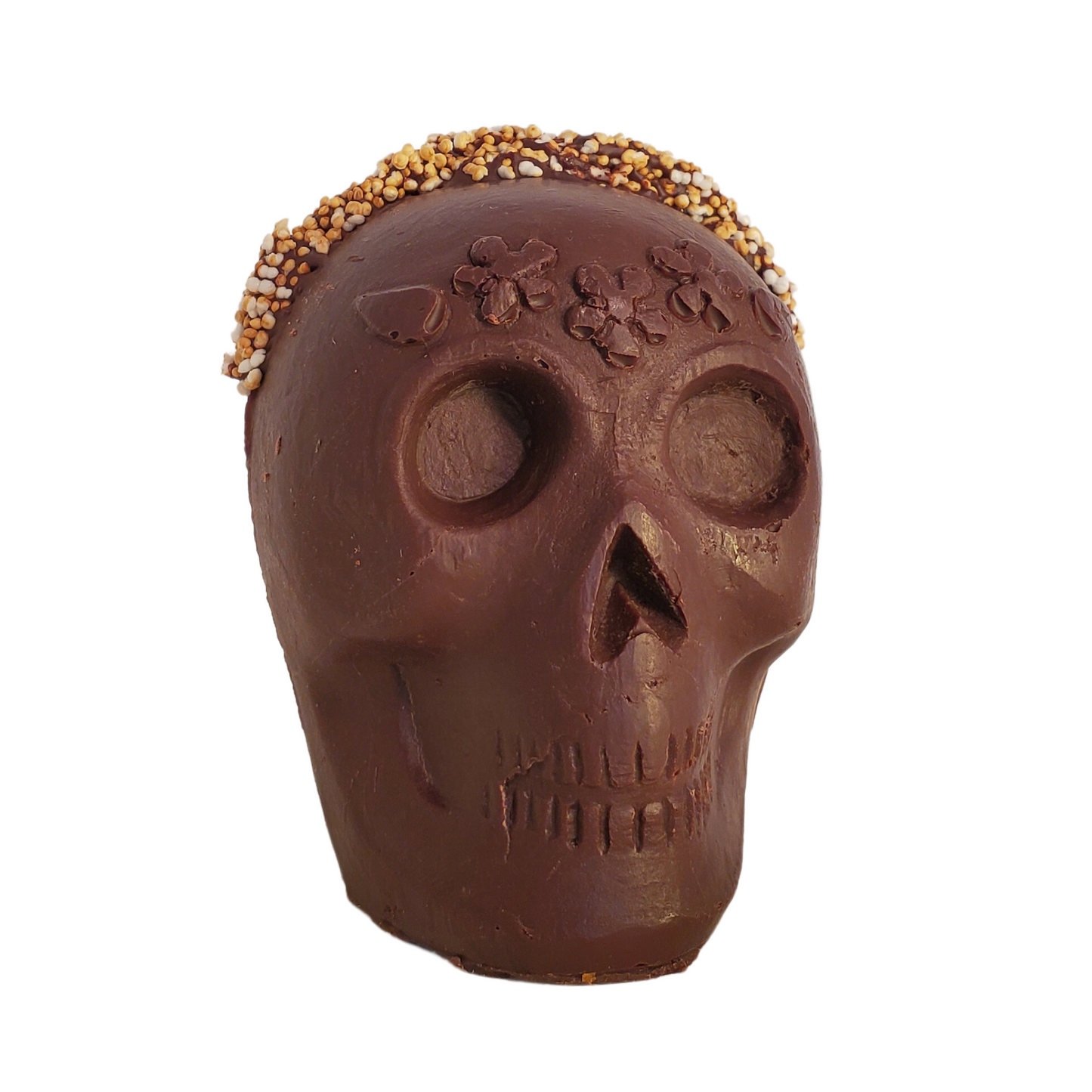 Chocolate skull figurine with white popped amaranth and flower headband decoration.