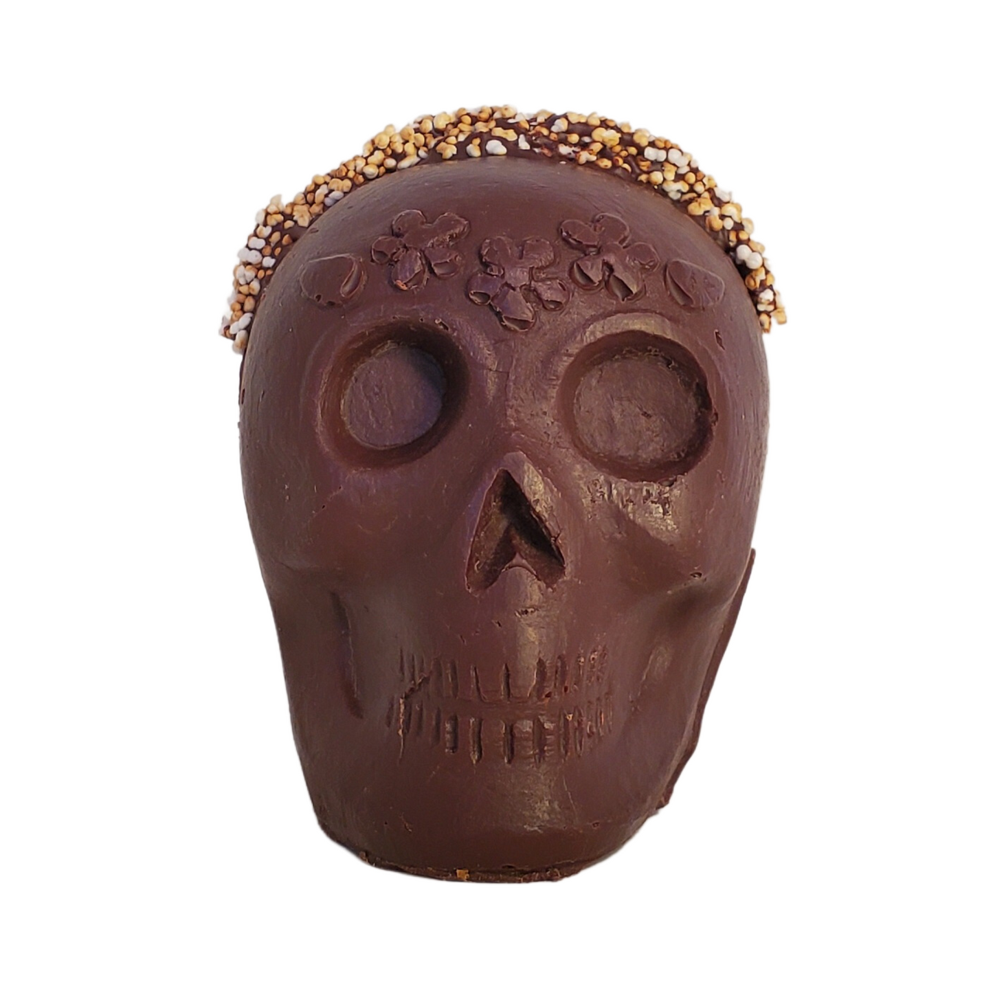 Chocolate skull figurine with white popped amaranth and flower headband decoration.