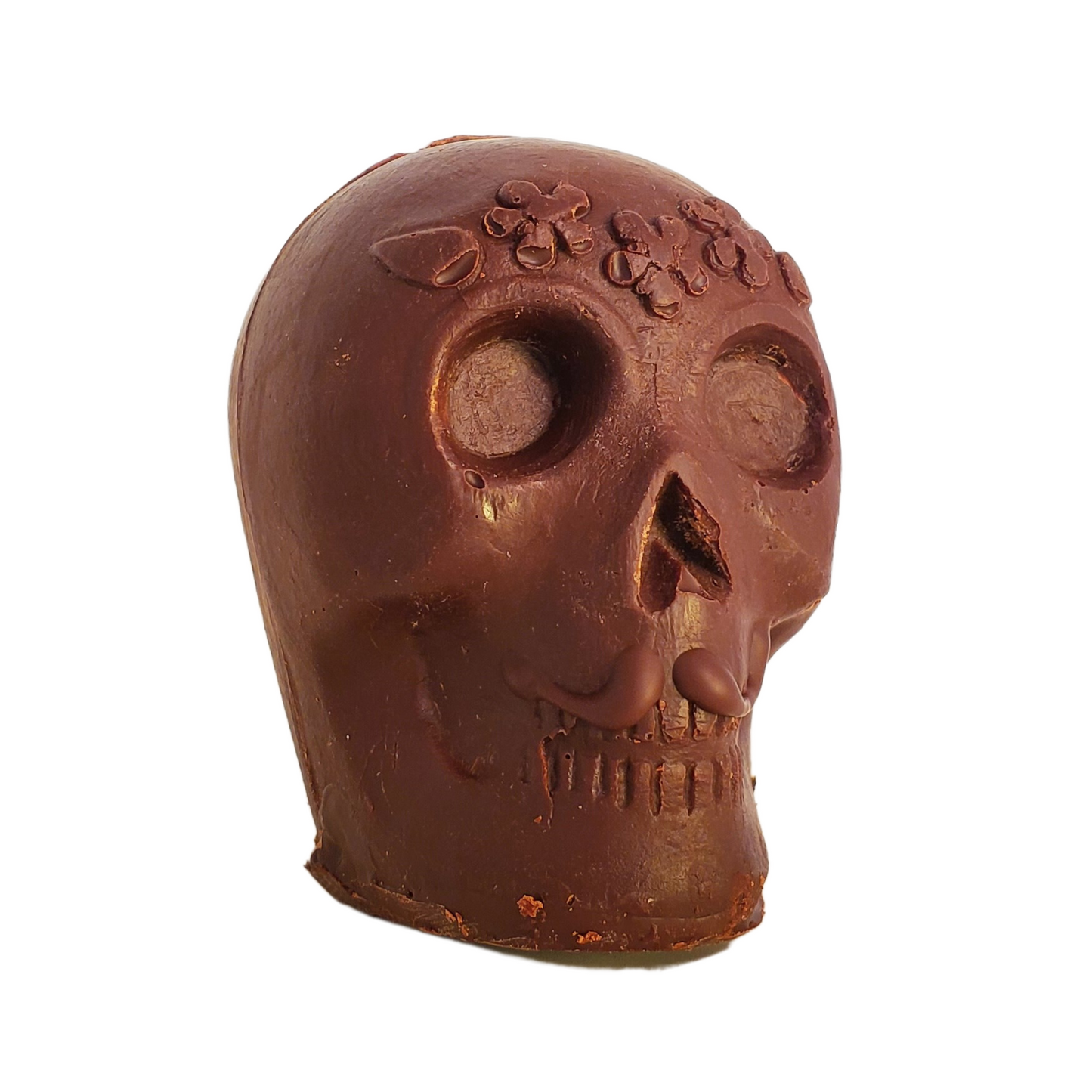 Chocolate skull figurine with a chocolate moustache and flower headband decoration.