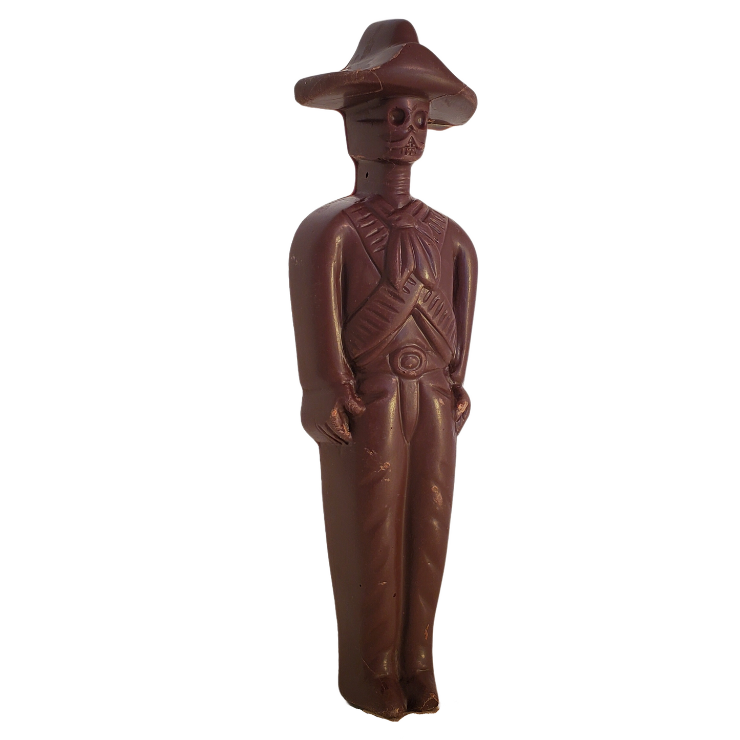Dark chocolate figure of a Zapatista rebel with a skull face and wearing a sombrero.