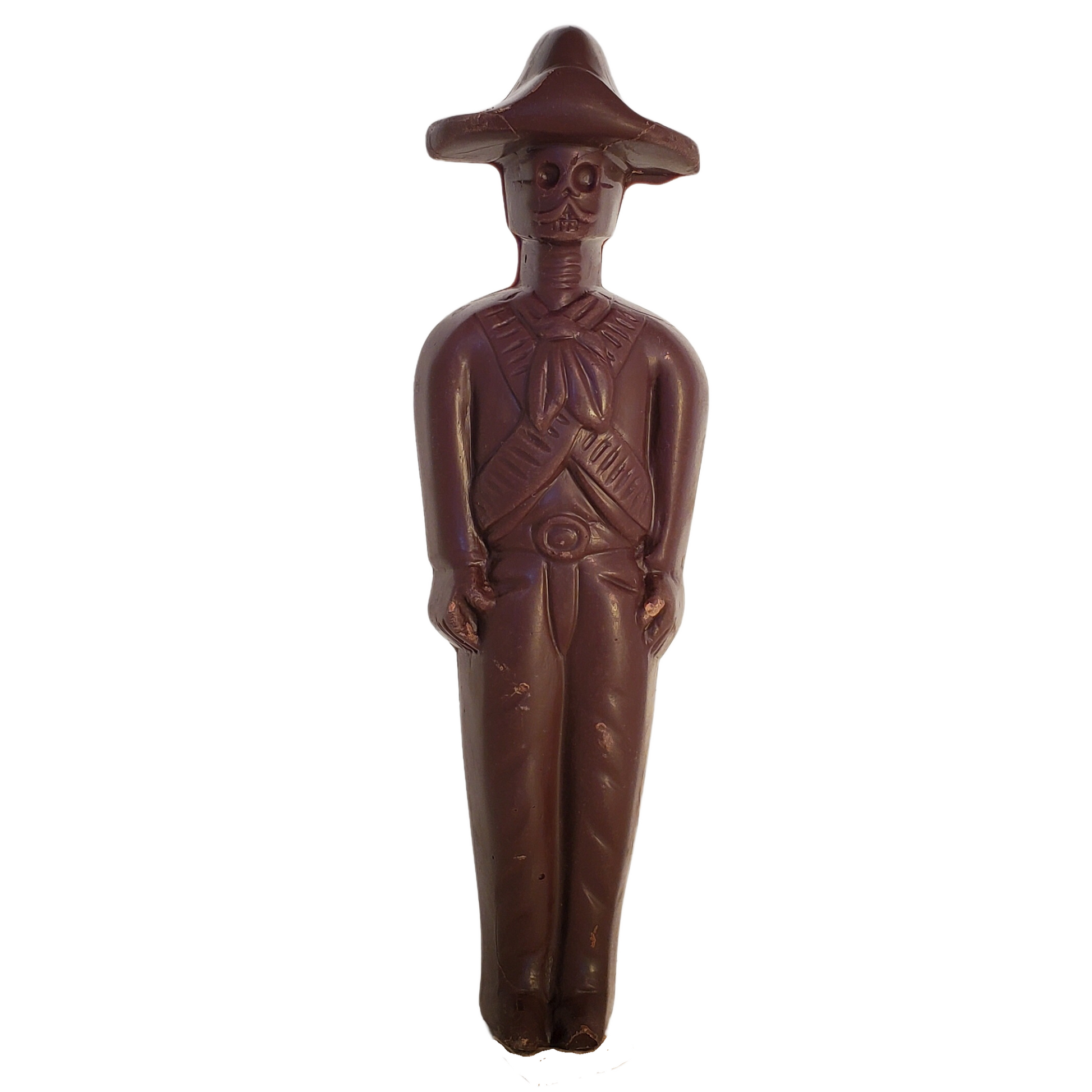 Dark chocolate figure of a Zapatista rebel with a skull face and wearing a sombrero.